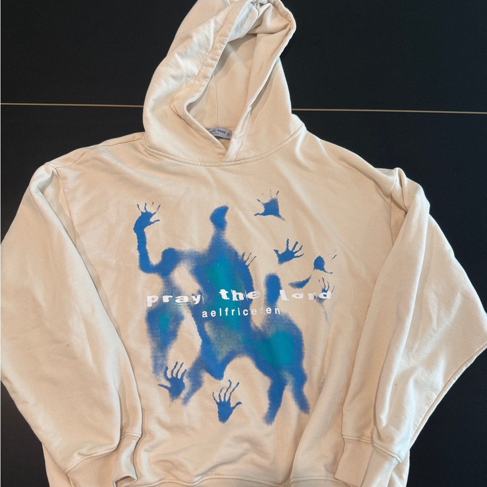 Aelfric Eden Pray the Lord Beige Hoodie with Blue Handprint Design